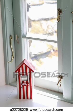 Close-up of red-striped miniature beach-hut on window-sill View Large Photo Image Stock Photograph - Close-up of red-striped miniature beach-hut on window-sill. Fotosearch