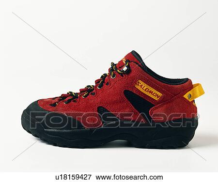 Stock Photo - Close-up of red suede trainer shoe. Fotosearch
