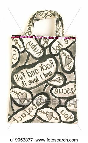 Stock Photo - Close-up of "Rock+Roll" letter patterned bag. Fotosearch