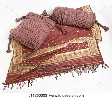 Close-up of ruched terracotta cushions on gold and terracotta throw View Large Photo Image Stock Image - Close-up of ruched terracotta cushions on gold and terracotta throw. Fotosearch