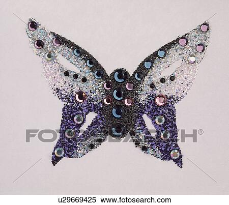 Stock Photography - Close-up of sequin butterfly brooch. Fotosearch