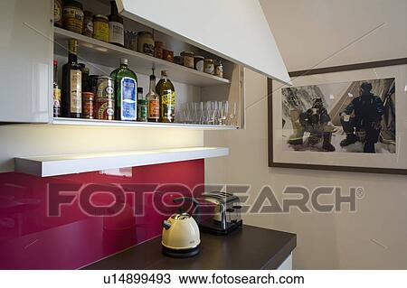 Close-up of slide-up cupboard door above kettle and toaster on kitchen worktop View Large Photo Image Stock Image - Close-up of slide-up cupboard door above kettle and toaster on kitchen worktop. Fotosearch