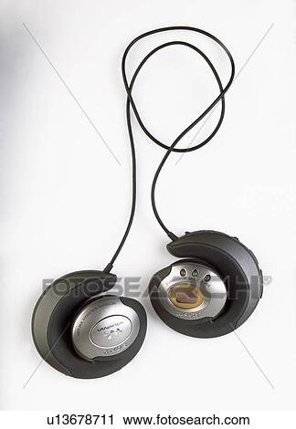 Stock Image - Close-up of small head-phones. Fotosearch