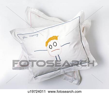 Close-up of small white cushion embroidered by a child View Large Photo Image Stock Image - Close-up of small white cushion embroidered by a child. Fotosearch