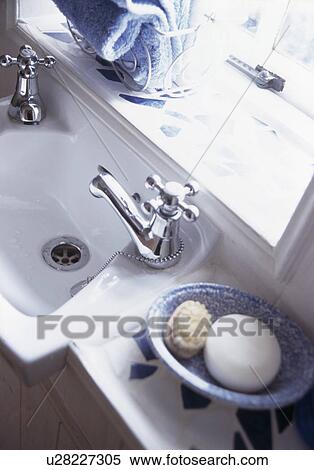 Close-up of soap in dish beside white basin with chrome tap View Large Photo Image Stock Photography - Close-up of soap in dish beside white basin with chrome tap. Fotosearch