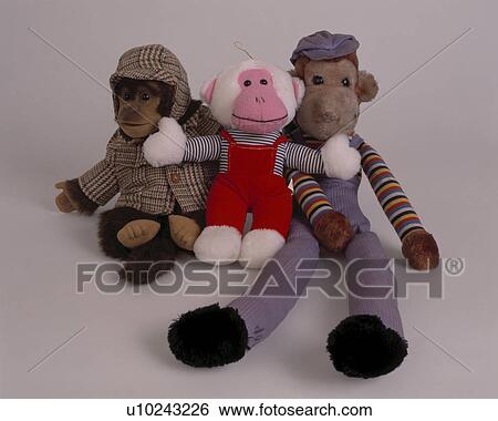 Close-up of soft toy monkeys dressed in clothes View Large Photo Image Stock Photograph - Close-up of soft toy monkeys dressed in clothes. Fotosearch