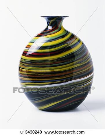 Close-up of spherical blown glass vase with multi-coloured stripes View Large Photo Image Stock Photo - Close-up of spherical blown glass vase with multi-coloured stripes. Fotosearch