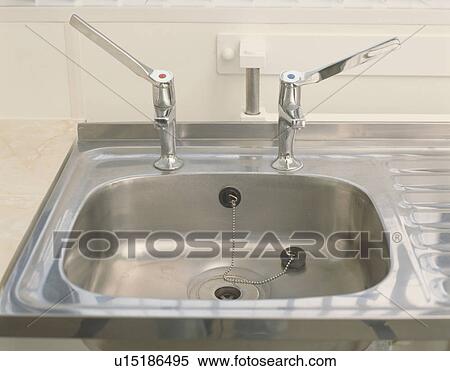 Close-up of stainless steel taps and sink View Large Photo Image Stock Photography - Close-up of stainless steel taps and sink. Fotosearch