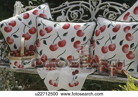 Close-up of stencilled cherry-print cushions on old white metal garden bench View Large Photo Image Stock Image - Close-up of stencilled cherry-print cushions on old white metal garden bench. Fotosearch