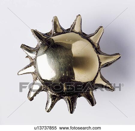 Close-up of sun-shaped metal door handle View Large Photo Image Stock Photography - Close-up of sun-shaped metal door handle. Fotosearch