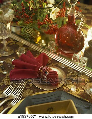 Close-up of table set for Christmas lunch with red napkin and red berry arrangement View Large Photo Image Stock Image - Close-up of table set for Christmas lunch with red napkin and red berry arrangement. Fotosearch