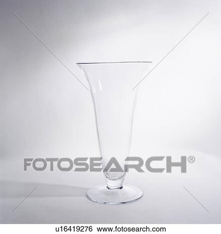 Close-up of tall fluted stemmed glass vase View Large Photo Image Stock Photograph - Close-up of tall fluted stemmed glass vase. Fotosearch