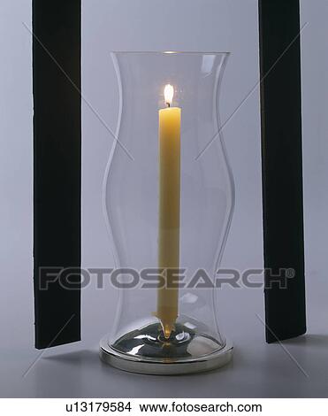 Close-up of tall lighted candle in glass storm-lantern View Large Photo Image Picture - Close-up of tall lighted candle in glass storm-lantern. Fotosearch