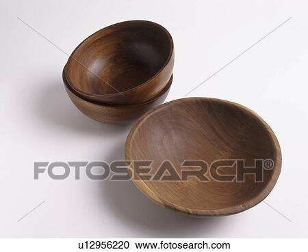 Stock Image - Close-up of three brown wooden bowls. Fotosearch