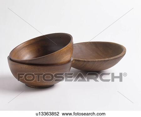 Stock Image - Close-up of three brown wooden bowls. Fotosearch