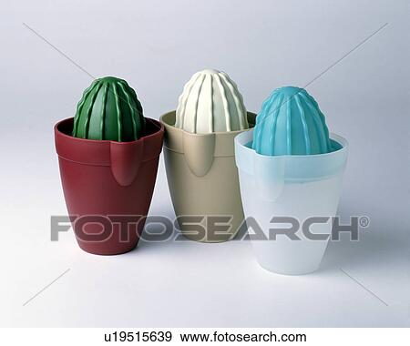 Stock Photo - Close-up of three colourful plastic lemon-squeezers in the form of cacti. Fotosearch