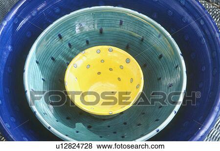 Close-up of three colourful pottery bowls View Large Photo Image Stock Photo - Close-up of three colourful pottery bowls. Fotosearch