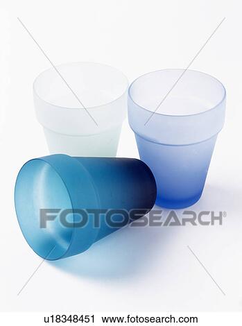 Stock Image - Close-up of three frosted glass tumblers. Fotosearch