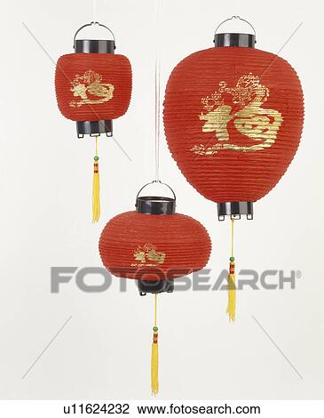Stock Image - Close-up of three red Chinese paper lanterns. Fotosearch