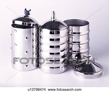 Close-up of three stainless-steel lidded canisters View Large Photo Image Picture - Close-up of three stainless-steel lidded canisters. Fotosearch