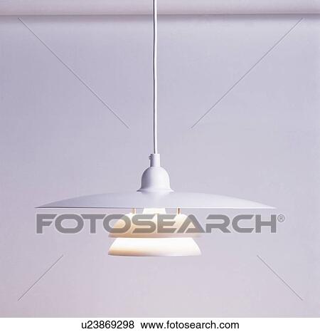 Stock Photo - Close-up of three-tier circular modern ceiling light. Fotosearch
