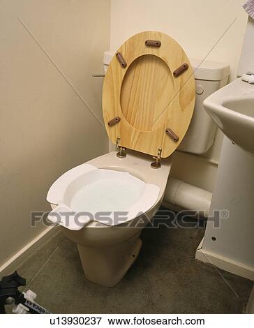 Stock Photo - Close-up of toilet with seat up. Fotosearch