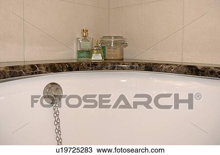 Stock Image - Close-up of toiletries on bath. Fotosearch