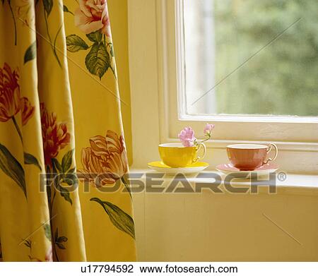 Close-up of tulip-patterned curtain beside window with yellow and pink cups on sill View Large Photo Image Stock Image - Close-up of tulip-patterned curtain beside window with yellow and pink cups on sill. Fotosearch