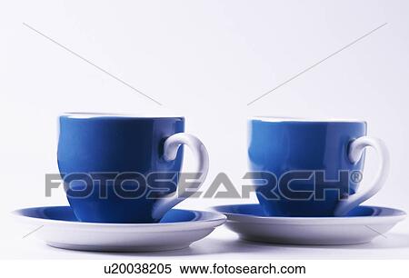 Close-up of two blue cups with white handles View Large Photo Image Stock Photography - Close-up of two blue cups with white handles. Fotosearch