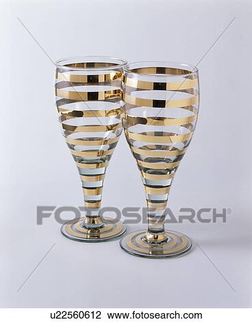Close-up of two gold-striped wine-glasses View Large Photo Image Stock Image - Close-up of two gold-striped wine-glasses. Fotosearch