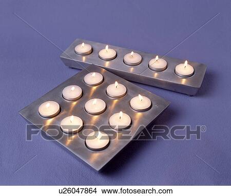 Close-up of two modern metal multi-candle holders View Large Photo Image Picture - Close-up of two modern metal multi-candle holders. Fotosearch