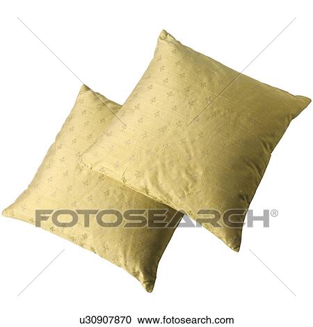 Stock Image - Close-up of two yellow silk cushions. Fotosearch