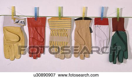 Close-up of variety of leather gardening gloves pegged out on line View Large Photo Image Stock Photo - Close-up of variety of leather gardening gloves pegged out on line. Fotosearch