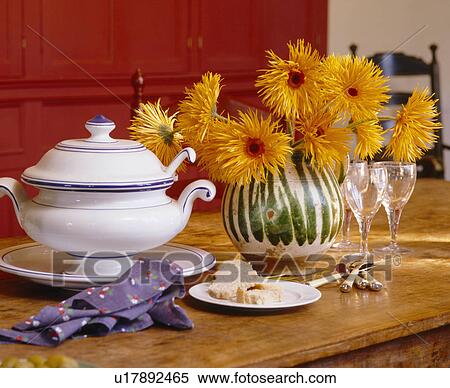 Close-up of vase of yellow chrysanthemums and white tureen on wooden table View Large Photo Image Stock Photography - Close-up of vase of yellow chrysanthemums and white tureen on wooden table. Fotosearch