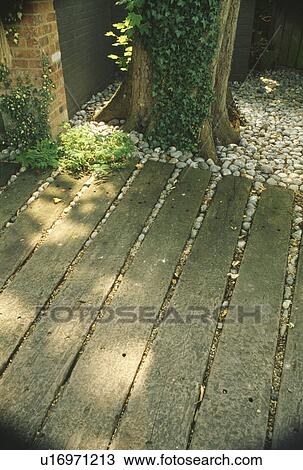 Stock Image - Close-up of weathered decking path. Fotosearch