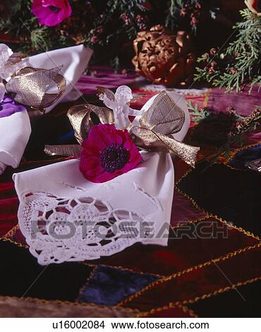 Close-up of white broderie-Anglaise table napkins decorated for Christmas View Large Photo Image Picture - Close-up of white broderie-Anglaise table napkins decorated for Christmas. Fotosearch