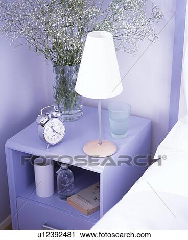Close-up of white lamp on blue shelves in bedroom View Large Photo Image Stock Image - Close-up of white lamp on blue shelves in bedroom. Fotosearch