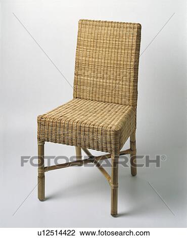 Stock Image - Close-up of wicker dining-chair. Fotosearch