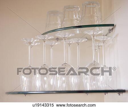 Close-up of wine glasses on glass corner shelves View Large Photo Image Stock Photography - Close-up of wine glasses on glass corner shelves. Fotosearch
