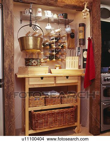 Picture - Close-up of wine storage and storage unit with wicker baskets. Fotosearch