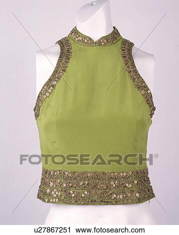 Close-up of woman's green silk sleeveless top with gold-beaded trim View Large Photo Image Stock Image - Close-up of woman's green silk sleeveless top with gold-beaded trim. Fotosearch