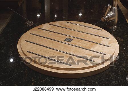 Stock Photo - Close-up of wooden worktop on sink. Fotosearch