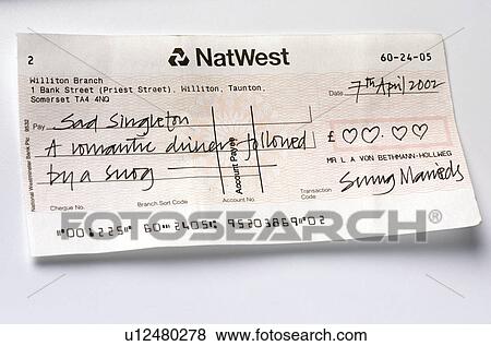 Close-up of written cheque View Large Photo Image Stock Photo - Close-up of written cheque. Fotosearch