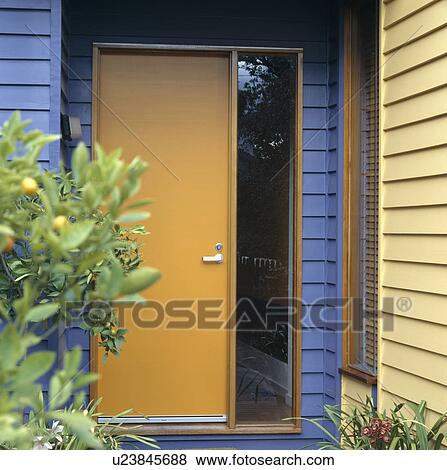 Close-up of yellow front door and glass panel in modern blue and yellow house View Large Photo Image Stock Photo - Close-up of yellow front door and glass panel in modern blue and yellow house. Fotosearch