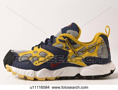 Close-up of yellow+black trainer shoe with white detail View Large Photo Image Picture - Close-up of yellow+black trainer shoe with white detail. Fotosearch