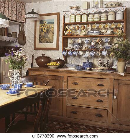 Stock Photography Of Collection China On Shelves Above Pine Collection Of China On Shelves Above Pine Dresser In Country Kitchen