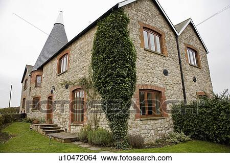 Picture - Converted brick and Kentish ragstone oast house in Kent. Fotosearch