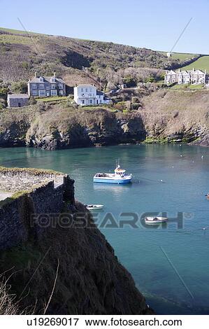 Stock Photo - Cornish fishing village with tide in.. Fotosearch