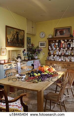 Country kitchen with large pine table and dresser. View Large Photo Image Picture - Country kitchen with large pine table and dresser.. Fotosearch