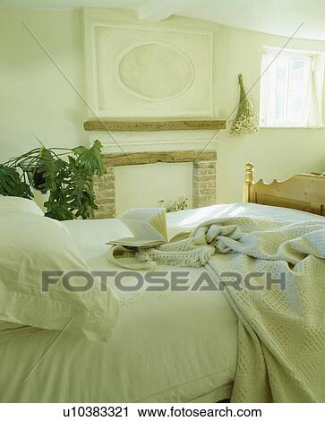 Cream bedlinen on bed in cream country bedroom View Large Photo Image Stock Image - Cream bedlinen on bed in cream country bedroom. Fotosearch